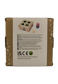 Cardboard box containing a shape sorting toy. Front features light-colored wood with animal graphics, five colored shapes, and cut-out slots.