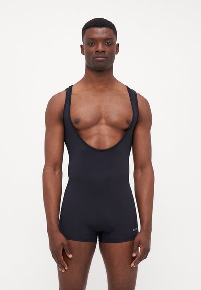 Costume da bagno nero senza maniche realizzato in materiale elasticizzato, con scollatura profonda, design aderente e copertura breve delle gambe. Logo del brand sul lato.