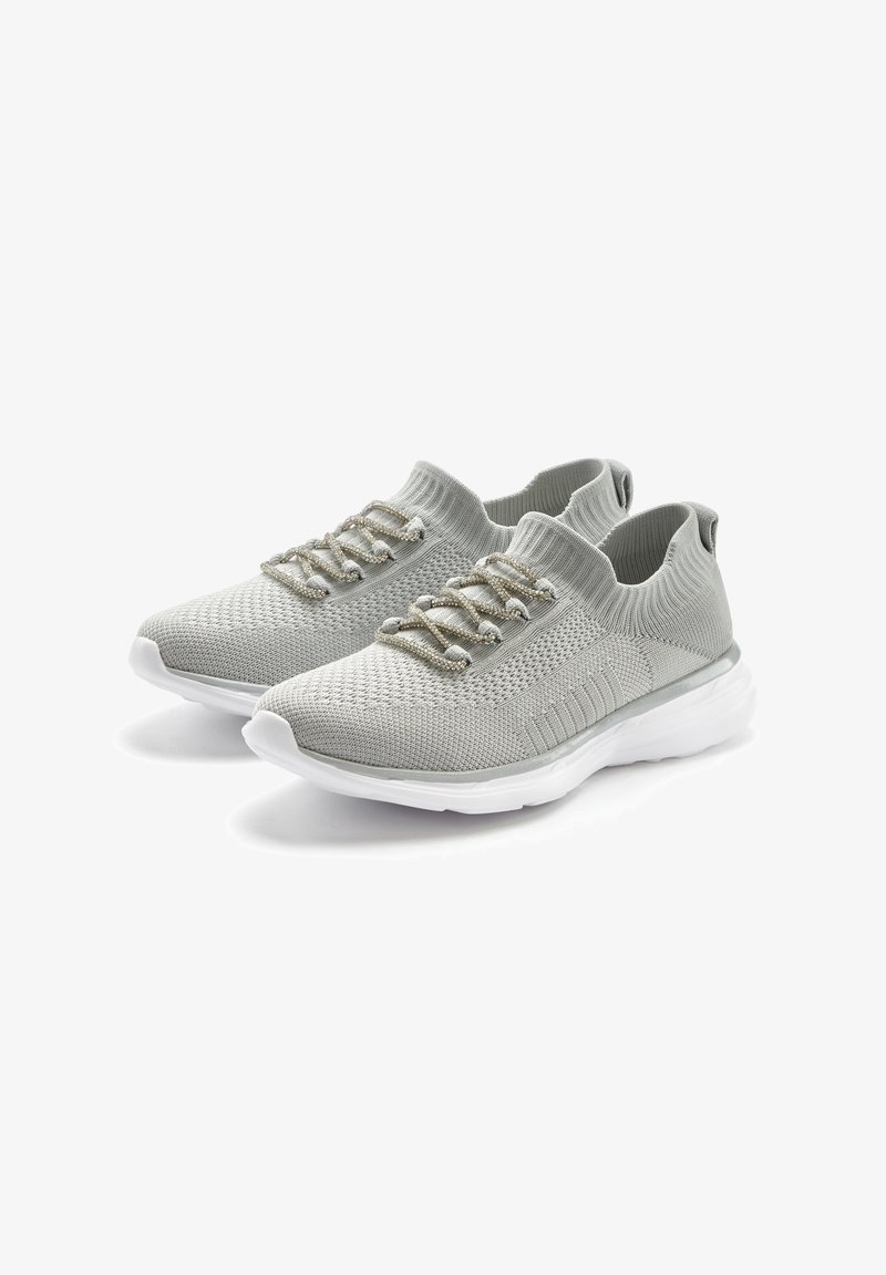 Light gray knitted athletic shoes with a seamless design, lace-up closures, and a white sole. Features textured upper and padded collar.