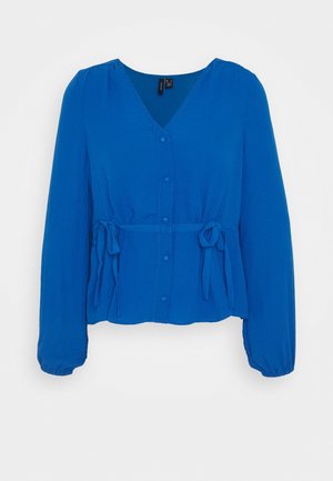 Blauwe blouse met lange mouwen, V-hals, knoopsluiting aan de voorkant, elastische manchetten en verstelbare taillebanden aan beide zijden.
