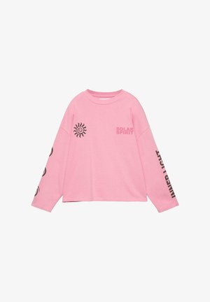 Roza majica z dolgimi rokavi s črnim sončnim motivom na prsih, napisom "SOLAR SPIRIT" in navpičnim napisom "INNER LIGHT" na desnem rokavu.