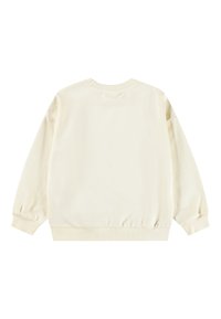 Sudadera de color crema con mangas largas, cuello redondo acanalado y puños. Tejido suave, corte relajado y sin patrones ni acentos visibles.