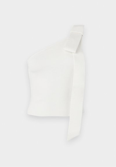 Asümmeetriline valge top, mis on valmistatud tekstuurist kangast. Omab ühte õlavarre rihma koos lipsu detailiga, rõhutades moodsa disaini elemente.