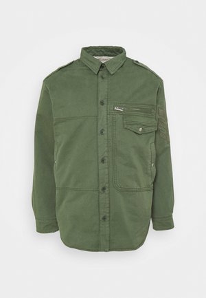 Green button-up jacket with collar, flap and zippered chest pockets, shoulder epaulets, and long sleeves against a light background.