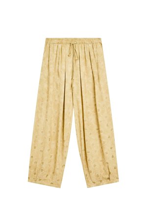 Pantalons larges jaune clair avec une taille élastique et un cordon de serrage, ornés d'un motif floral subtil sur l'ensemble du tissu.
