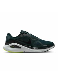 Scarpa da corsa verde scuro con dettagli neri, tomaia in rete e suola bianca con un particolare verde lime. Logo Nike sul lato.