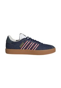 Blue denim sneakers with brown rubber sole, white tongue, and navy laces. Features three red and white stripes on the side and logo.