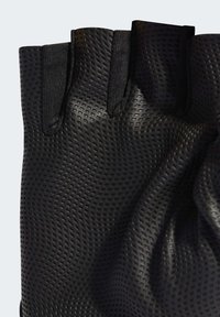 Svarta fingerlösa handskar gjorda av texturerat, andningsbart material med ett mönstrat ytskikt och förstärkt söm längs kanterna.