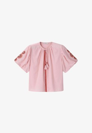 Light pink short-sleeve blouse with round neckline, front red embroidered trim with tassels, and circular embroidered patterns on both sleeves.