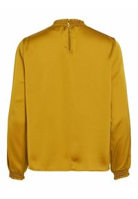 Blouse jaune moutarde en satin lisse. Comprend des manches longues avec poignets élastiques et un col froncé. Fermeture éclair au dos.