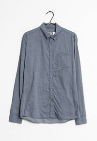 Košile s dlouhým rukávem v námořnické modré barvě s malým kostkovaným vzorem, zapínání na knoflíky v přední části, jediná náprsní kapsa a zakřivený lem.