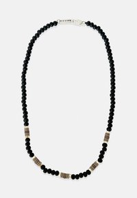 Čierny korálkový náhrdelník s kovovými a textúrovanými akcentmi. Hladké čierne korálky prerušené hnedými a zlatými prvkami. Bezpečné zapínanie.