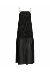 Juoda suknelė su plonomis petnešėlėmis, tekstūruotas liemuo su iškiliais raštais ir laisvas, šiek tiek permatomas A forma sijonas.