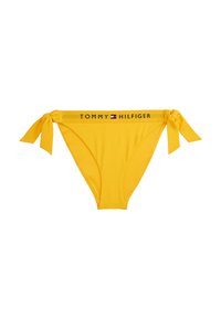 Yellow bikini bottom with a tie-side design. Features a contrasting band with "TOMMY HILFIGER" logo and smooth, stretchy fabric.