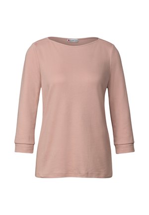 Lichtroze langslavige vrouwen top met bootnek en omgeslagen mouwen, weergegeven op een witte achtergrond.