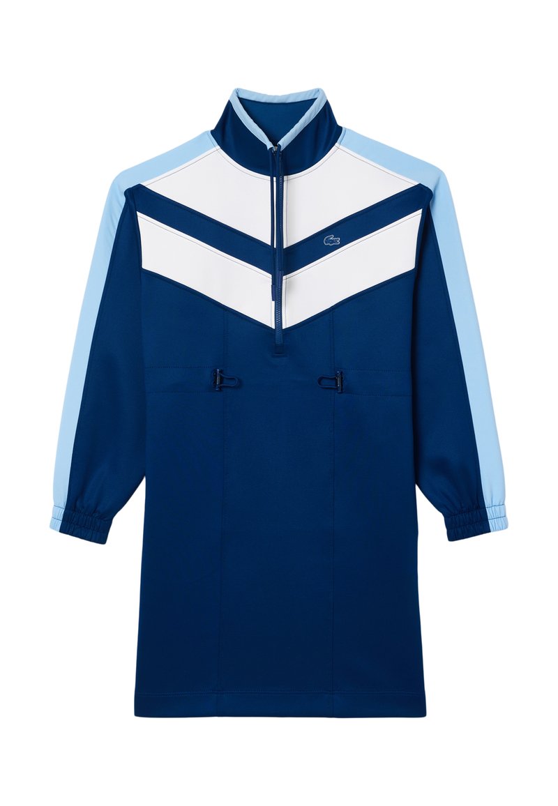 Camiseta de pullover azul marino con cuello alto, diseño de flechas en blanco y azul claro, puños elásticos y toggles ajustables en el dobladillo.