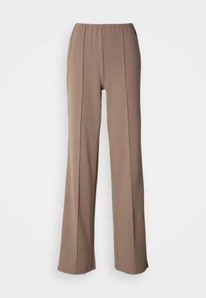Brown, wide-leg trousers with an elastic waistband, featuring two vertical pleats running down the front. Smooth, lightweight fabric texture.
