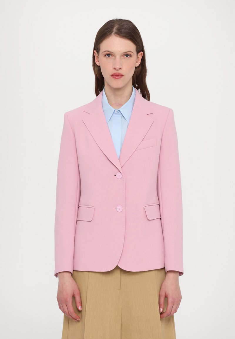 Pink blazer with a tailored fit, two buttons, and flap pockets. Made from smooth fabric, featuring a notch lapel and minimal detailing.