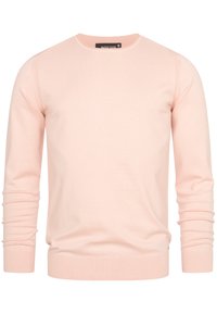 Pull rose clair à manches longues, col rond, poignets et ourlet côtelés. Confectionné dans un matériau doux, avec des détails cousus aux coutures.