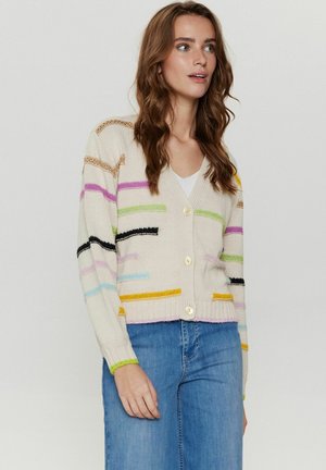 Crème cardigan met multicolore strepen in roze, zwart, paars en geel. Heeft een V-hals en knoopsluiting, geribbelde manchetten en onderrand.