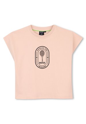Chemise rose clair à manches courtes avec logo noir de l'Open d'Australie Melbourne et graphique raquette de tennis centré sur le devant.