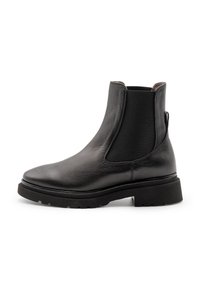 Schwarze Leder-Stiefeletten mit elastischen Seitenteilen, runder Zehenpartie und strukturierter Gummisohle. Nahtloses Design und minimalistische Hardware-Akzente.
