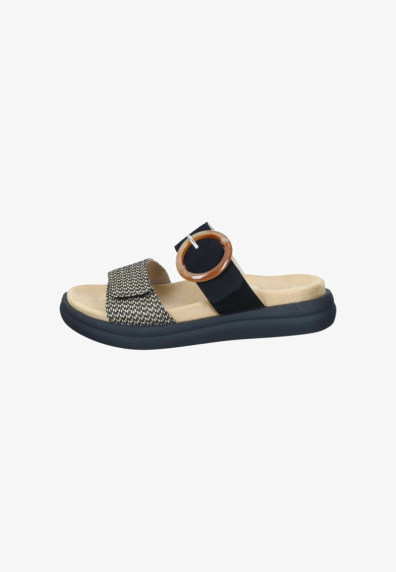 Svart och beige sandal med ett texturerat vävt band, cirkulär accent och en dämpad sula, med en lätt upphöjning och en hållbar botten.