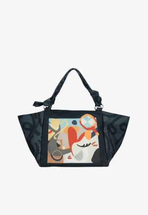 Borsa nera con design astratto geometrico e colorato con volto sul davanti, dotata di due manici intrecciati e ampi pannelli laterali.