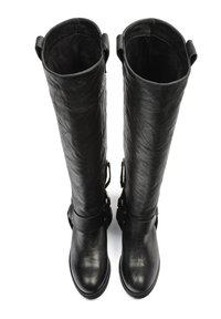 Black leather knee-high boots with a wrinkled texture, adjustable straps, and metallic buckles, featuring a round toe and flat sole.