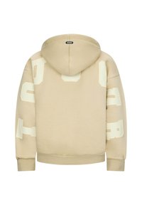 Felpa beige con tessuto strutturato, caratterizzata da grandi lettere bianche stampate sulle maniche e sulla schiena, e un cappuccio con cordino.
