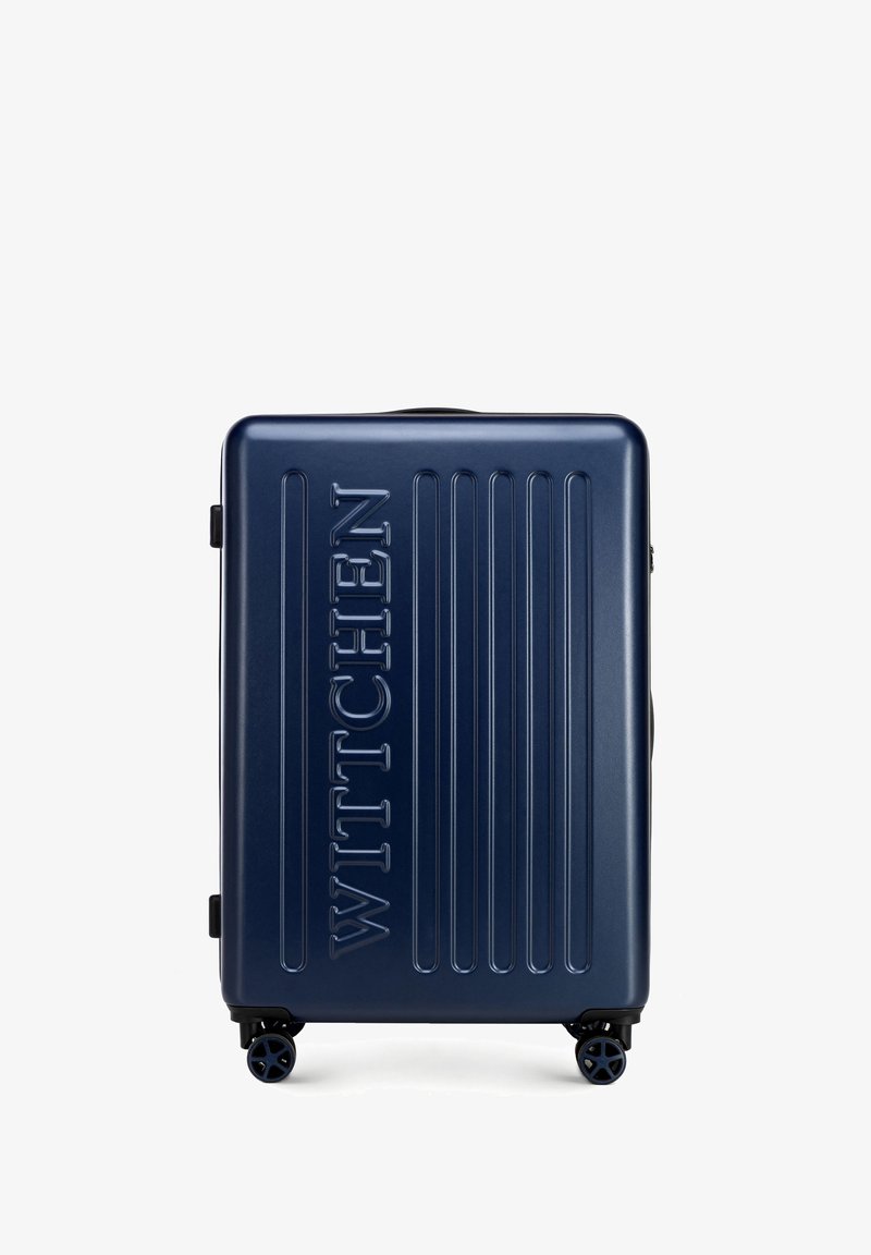 Maleta rígida de la marca Navy con acanalado vertical, logo en relieve "WITTCHEN", cuatro ruedas giratorias y un mango retráctil.