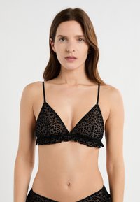 Schwarzes Spitzen-Bralette mit dreieckiger Form, featuring Leopardenmuster, gerafftem Saum und dünnen verstellbaren Trägern. Weiche Textur mit zarten Verzierungen.