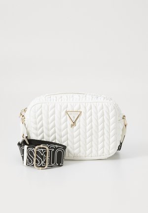 White quilted shoulder bag with gold hardware and triangular logo. Features a detachable black strap with white text. Compact and structured design.