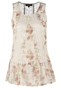 Blouse fleurie avec un fond crème, détails en dentelle, encolure ronde et ourlet évasé. Présente des motifs de roses roses et vertes.