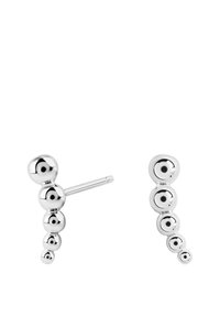 Srebrne kolczyki w kształcie sztyftów z opadającą linią sześciu kulistych koralików o różnych rozmiarach, z połyskliwym wykończeniem.