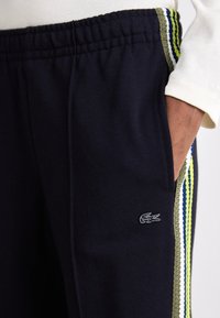 Lacoste Treniņtērpa apakšdaļas - abysm