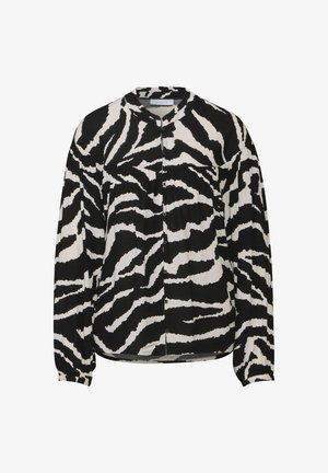 Czarna i biała bluzka z długim rękawem w zebrze, okrągłym dekoltem i zapięciem na guziki z przodu. Miękka, lekka tkanina.