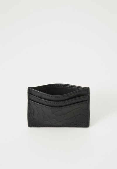 Black wallet made of textured faux leather with a crocodile pattern, featuring three card slots and an open top for easy access.