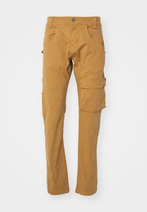 Cargo pants in a tan color, made of soft cotton, featuring multiple pockets, straight legs, and a button closure. Plain texture.