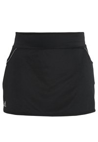 Svart träningskjol med en slät textur, elastisk midja och två dragkedjefickor på sidorna. Har en logotyp på nedre vänstra delen.