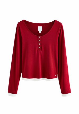 Rode lange mouwen top met een ronde hals, vijf knopen en witte manchetten aan de mouwen. Gemaakt van zachte stof, casual ontwerp.