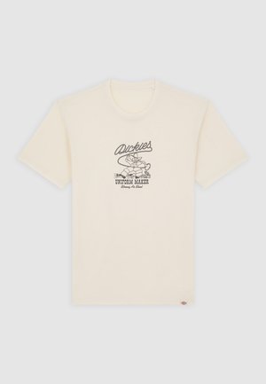 Camiseta de algodón de color crema y manga corta, con un estampado gráfico negro que incluye texto y un personaje de dibujos animados en la parte frontal.