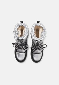 Silver metallic winter boots with a plush beige lining, adjustable drawstring top, and black accents, featuring grey laces and rubber soles.