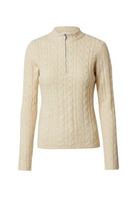 Cremfarbener Pullover mit hohem Kragen und Reißverschluss, der ein strukturiertes Zopfmuster und lange Ärmel aufweist.