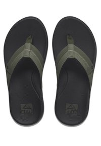 Tongs vertes et noires avec des semelles texturées, des sangles en tissu et un logo sur le pied. Les sangles présentent des accents de couture détaillés.