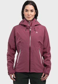 Burgunderrotes wasserdichtes Jackett mit Kapuze, verstellbaren Zugbändern, Reißverschluss auf der Vorderseite und zwei Seitentaschen. Verfügt über silberne Akzente und Logo.