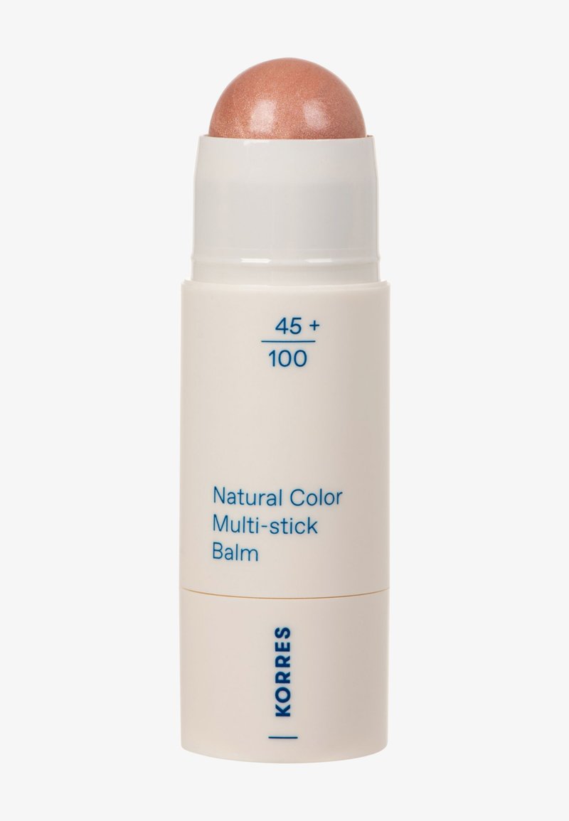 Natural Color Multi-stick Balm in a cylindrical white container. The top is a glossy rose-gold hue. Features blue text with product details.