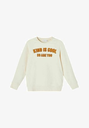 Sudadera color crema hecha de un tejido suave, con mangas raglán, cuello redondeado y texto naranja suave que dice "SER AMABLE ES GENIAL, TÚ TAMBIÉN LO ERES."