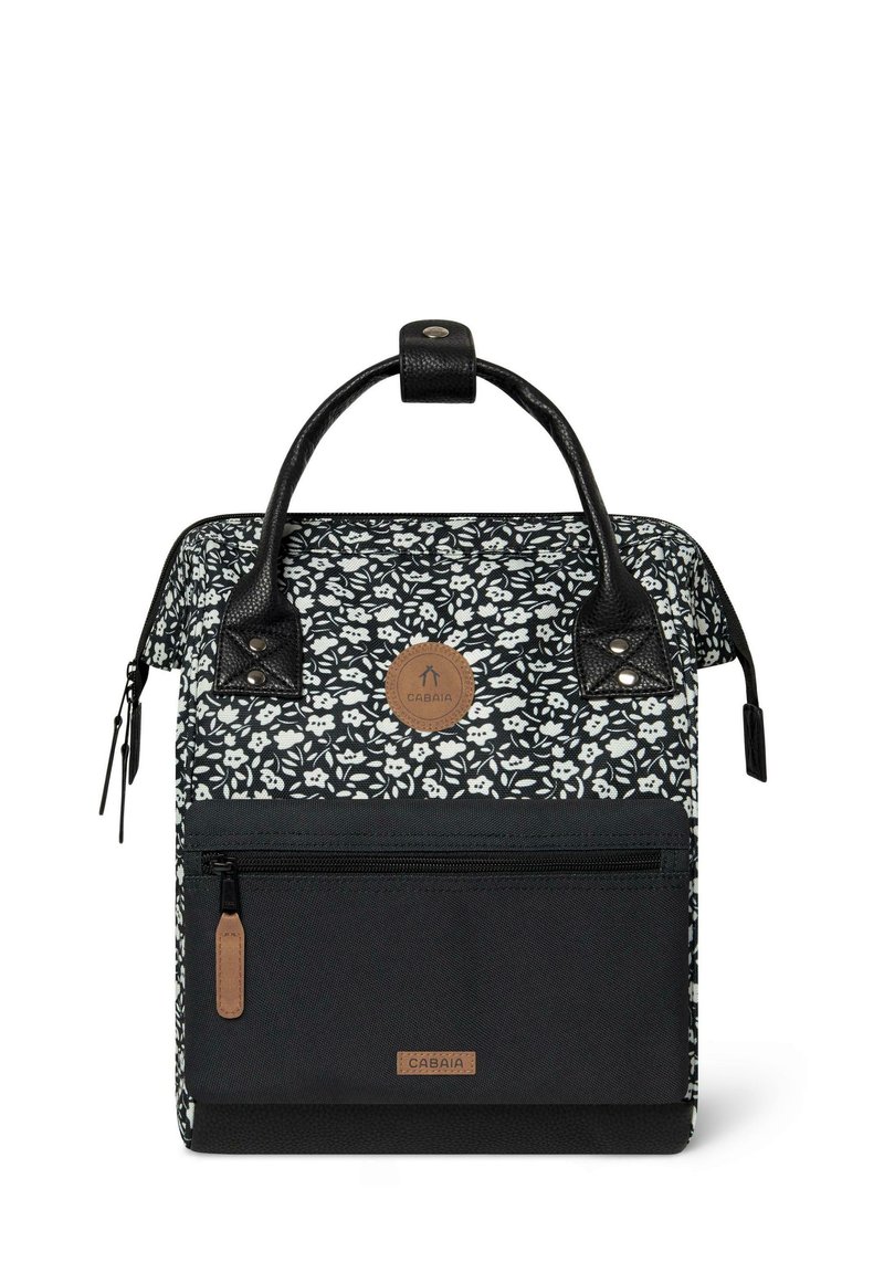 Black and white floral patterned backpack with two black handles, a front pocket, and a brown logo patch. Made from durable fabric.