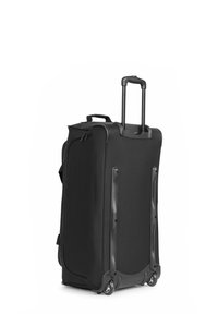 Valise noire à roues en tissu avec une finition lisse, dotée d'une poignée rétractable et d'une base en plastique durable, équipée de roues.